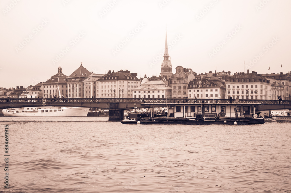 Scenic panorama of the old town, boats, bridge in Stockholm, Sweden. Toned image