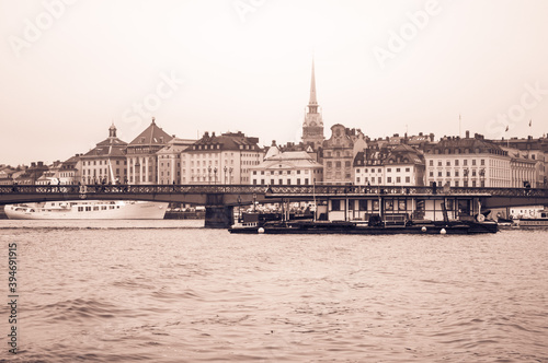Photography Scenic panorama of the old town, boats, bridge in Stockholm, Sweden