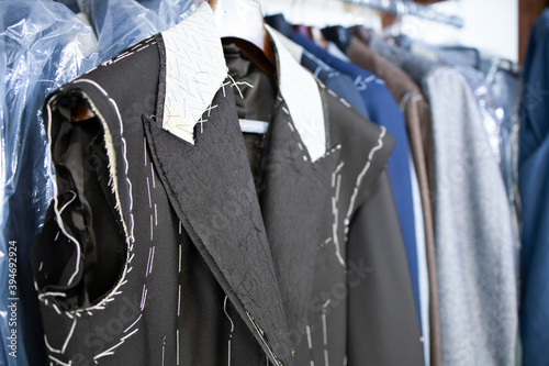 Canvastavla Male jacket basted on coat hunger in the tailor's shop