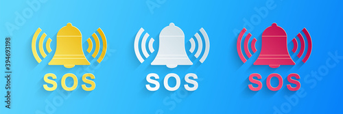 Paper cut Alarm bell and SOS lettering icon isolated on blue background. Warning bell, help sign. Emergency SOS button. Paper art style. Vector.