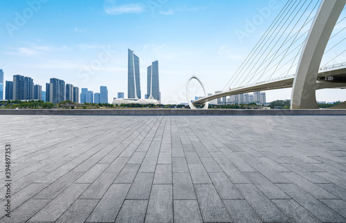 Empty plaza floor and Nanjing Eye Pedestrian Bridge in Nanjing, China