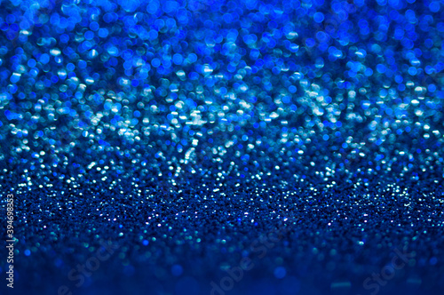 Blue,dark blue bstract light background, shining lights, sparkling glittering Christmas lights. Blurred abstract .holiday background.