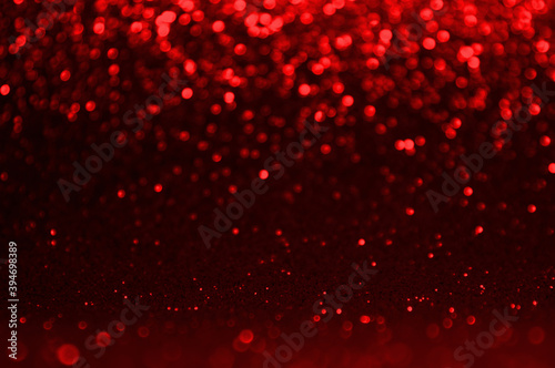 Dark red, grey,black abstract light background, Red shining lights, sparkling glittering Christmas lights. Blurred abstract holiday background.
