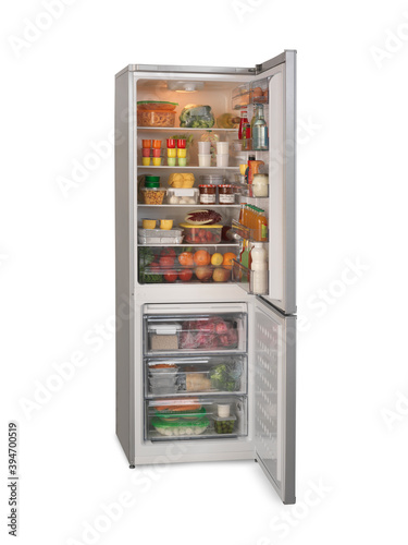 refrigerator with open freezer full of various food