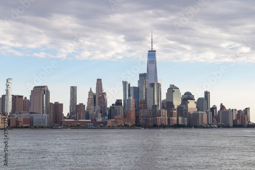 Lower Manhattan Skyline along the Hudson River in New York City with Beautiful Clouds © James