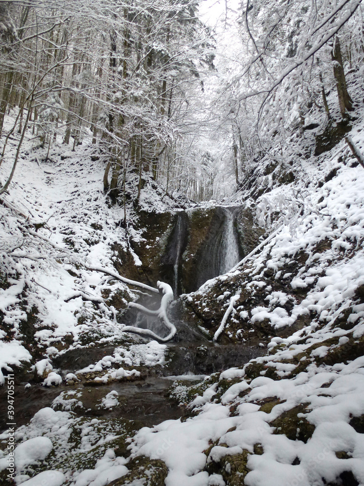 Waterfall at winter mountain tour to Seekarkreuz mountain, Bavaria, Germany