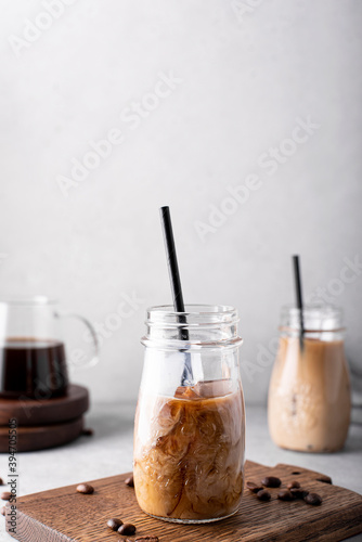 Obraz na płótnie cold coffee with milk in small bottles w salonie