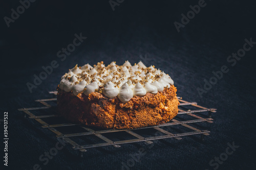 Detail of gluten free almond cake, covered with mascarpone and almond pieces.