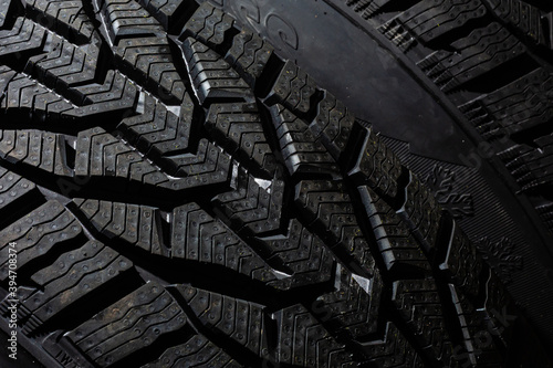 Car tire on black background