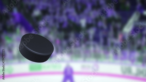 Hockey puck in the air. The crowd of fans on a blurred background. Sport games