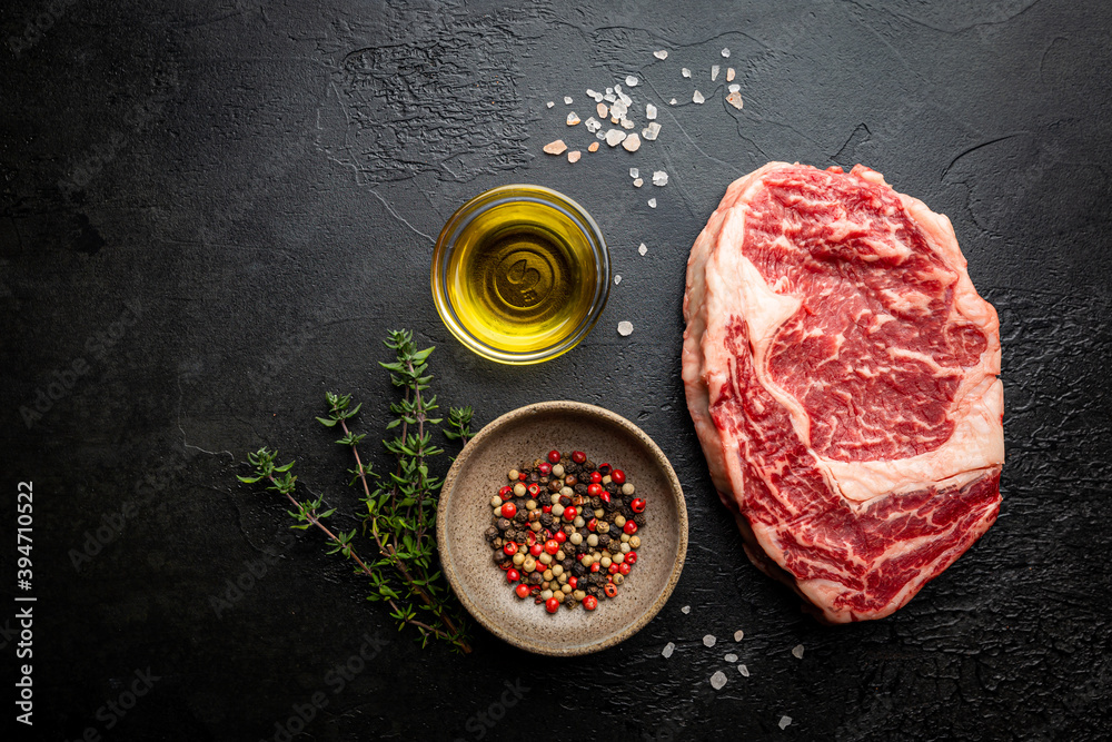 Raw fresh meat Ribeye beef Steak on black background, top view