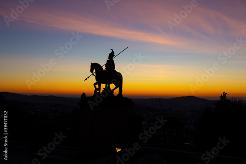 The public monument of "Sao Longuinho", famous statue silhouette at sunset in Bom Jesus do Monte, Braga, Minho, Portugal.