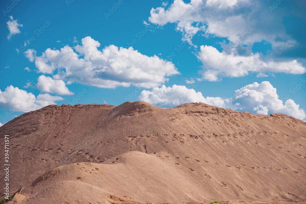 large pile of sand against the sky large pile of sand against the sky