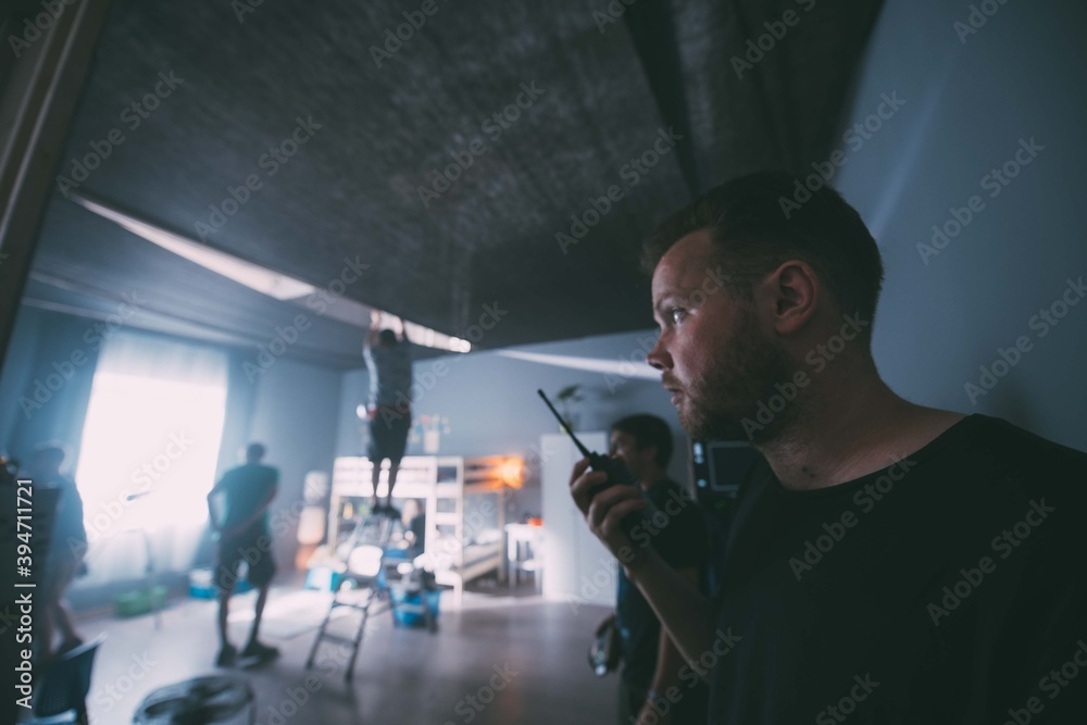 Director at work on the set. The director works with a group Director at work on the set. The director works with a group
