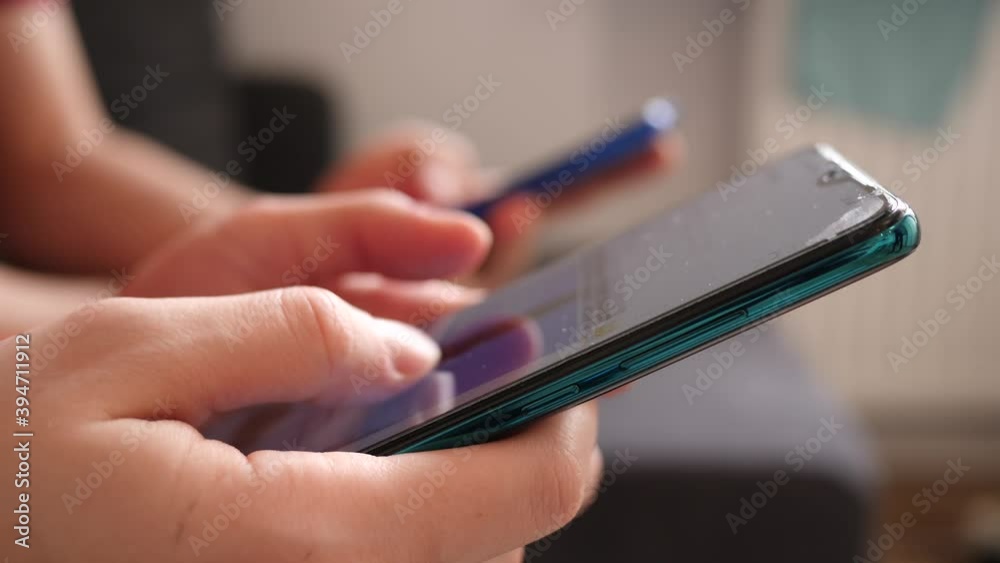 Closeup people stay at home use smartphones social media beeing bored under quarantine isolation slide type touchscreen displays of mobile phones Closeup people stay at home use smartphones social media beeing bored under quarantine isolation slide type touchscreen displays of mobile phones