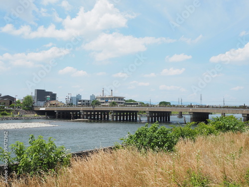 Famous Uji bridge across Uji river in Uji town near Kyoto recognized as one of the three most ancient bridges in Japan