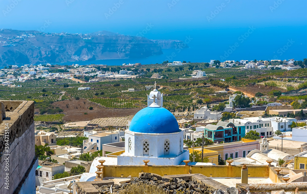 A panorama view from the castle ruins in Pyrgos, Santorini in summertime
