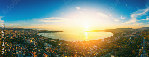 Big aerial panorama of Gelendzhik town resort, small city for vacation with beautiful bay at sunset in Krasnodarskiy region, Russia. photo