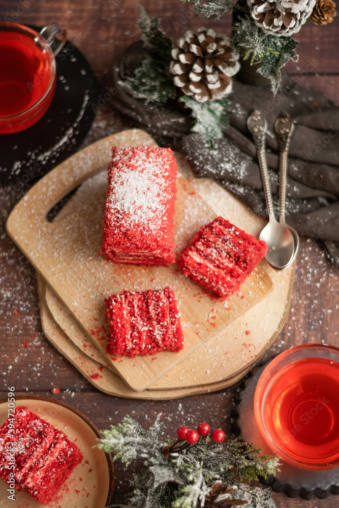 Strawberry piece of cake and red fruit tea, with winter decorations Strawberry piece of cake and red fruit tea, with winter decorations