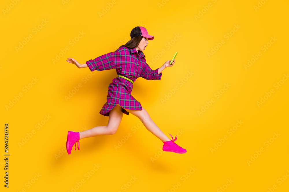 Full body profile photo of shocked model read bad news post wear checkered isolated on yellow color background