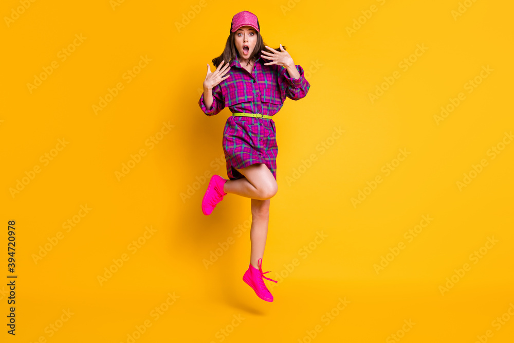 Full body photo of shocked person jump impressed reaction wear cap violet outfit isolated on yellow color background
