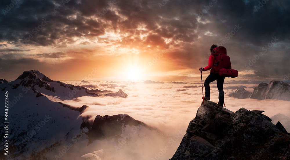 Girl Backpacker on top of a Mountain Peak. Dreamscape Artistic Render Composite. Landscape background from British Columbia, Canada. Dark Dramatic Sunrise Sky.