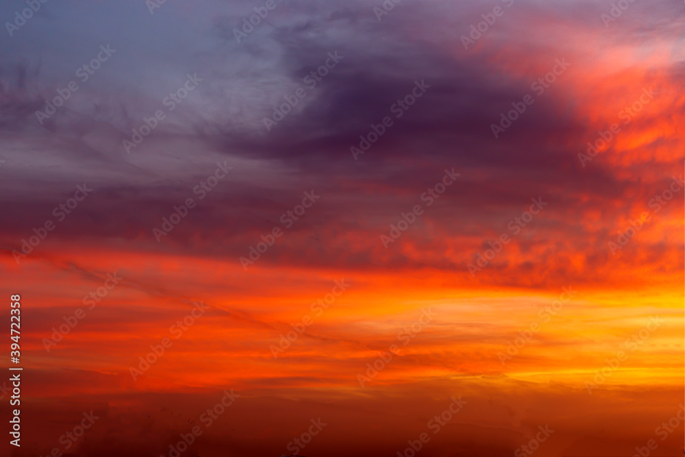Beautiful sunset sky with orange and pink clouds. Natural background Beautiful sunset sky with orange and pink clouds. Natural background