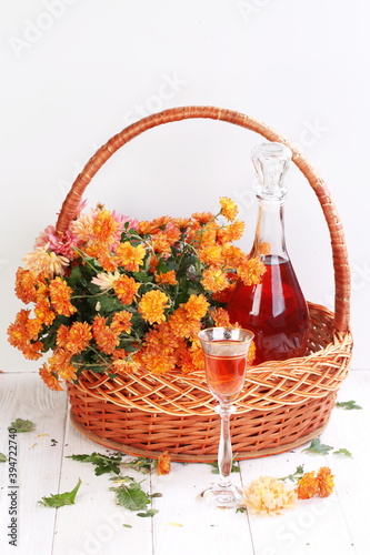 Still life with wine and flowers on a white background