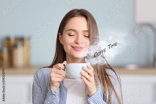 Beautiful young woman drink...