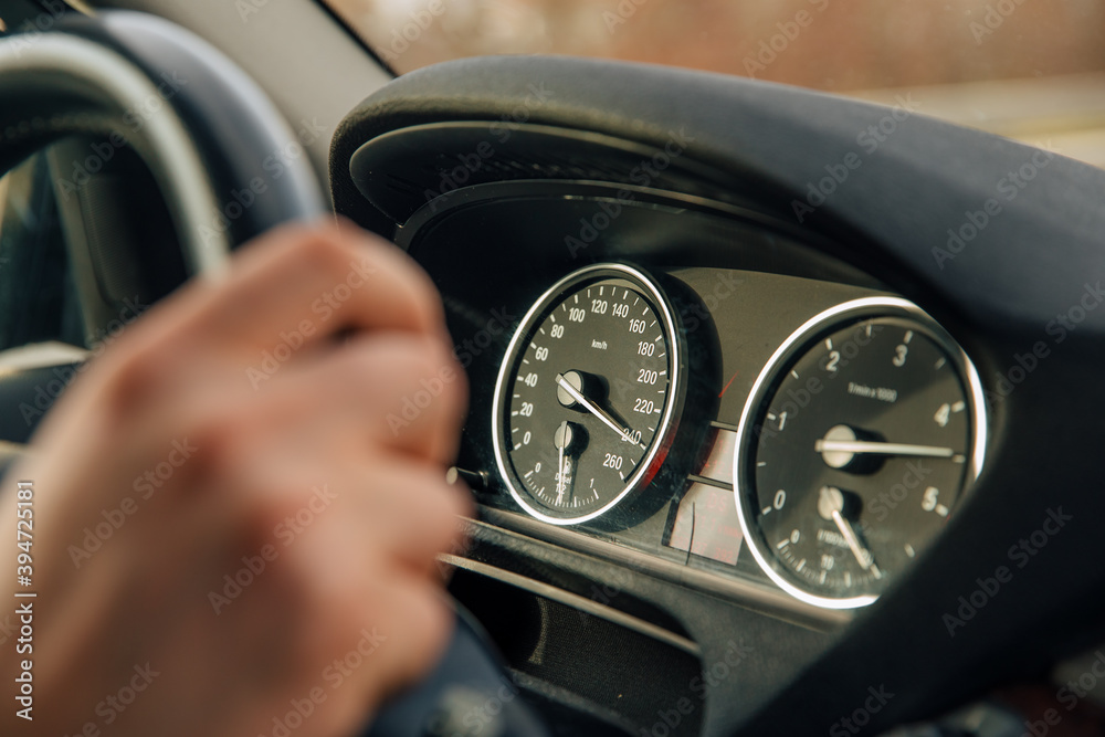Obraz premium In a car, the tahometer shows a speed of 240 kilometers per hour