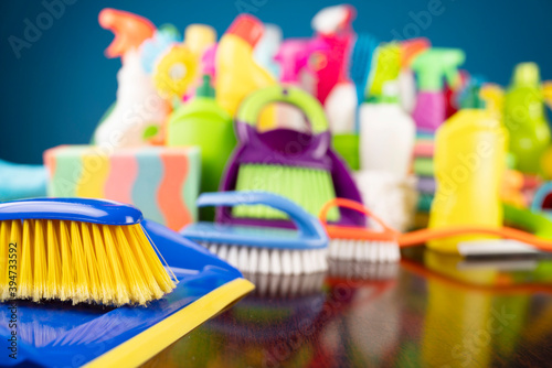 House and office cleaning theme. Colorful cleaning kit on blue background.