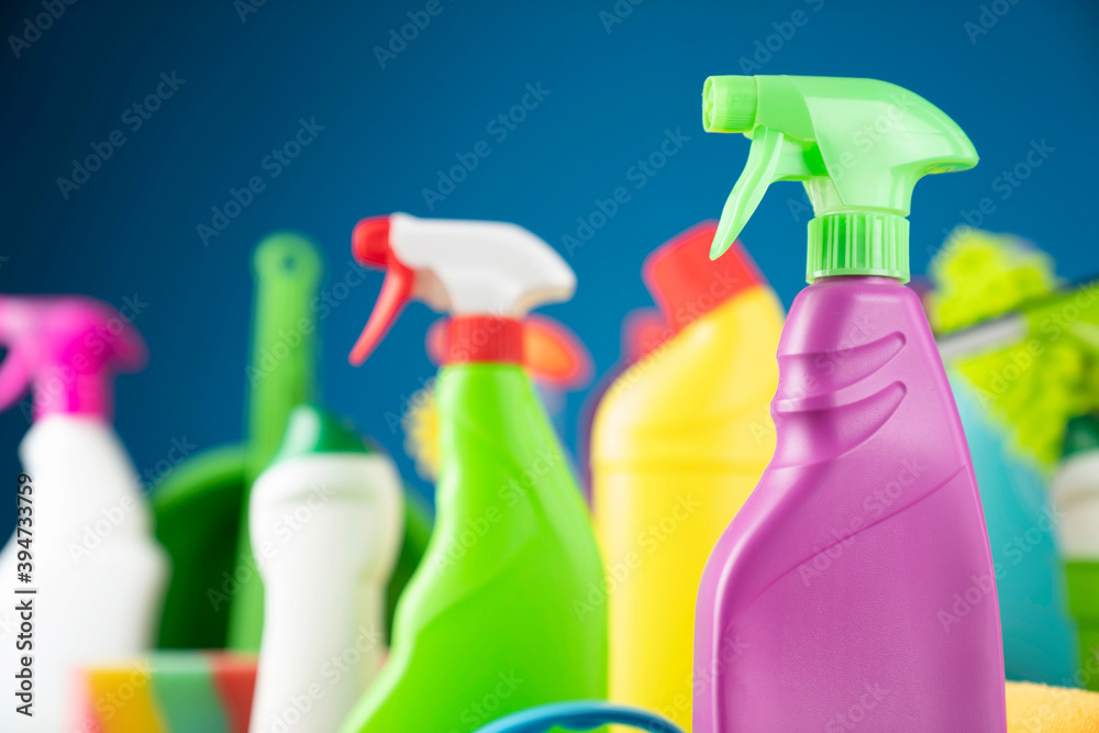 House and office cleaning theme. Colorful cleaning kit on blue background. House and office cleaning theme. Colorful cleaning kit on blue background.