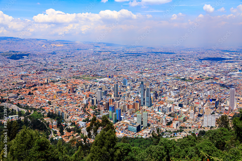 BOGOTA,COLOMBIA/MARCH 15,2018:Panoramic view of the city of Bogota. In the foreground are slum roofs.