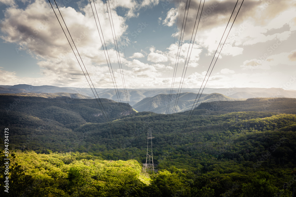 © Brayden Howie/Austockphoto - High voltage power lines pass through natural bushland in Blue Mountains