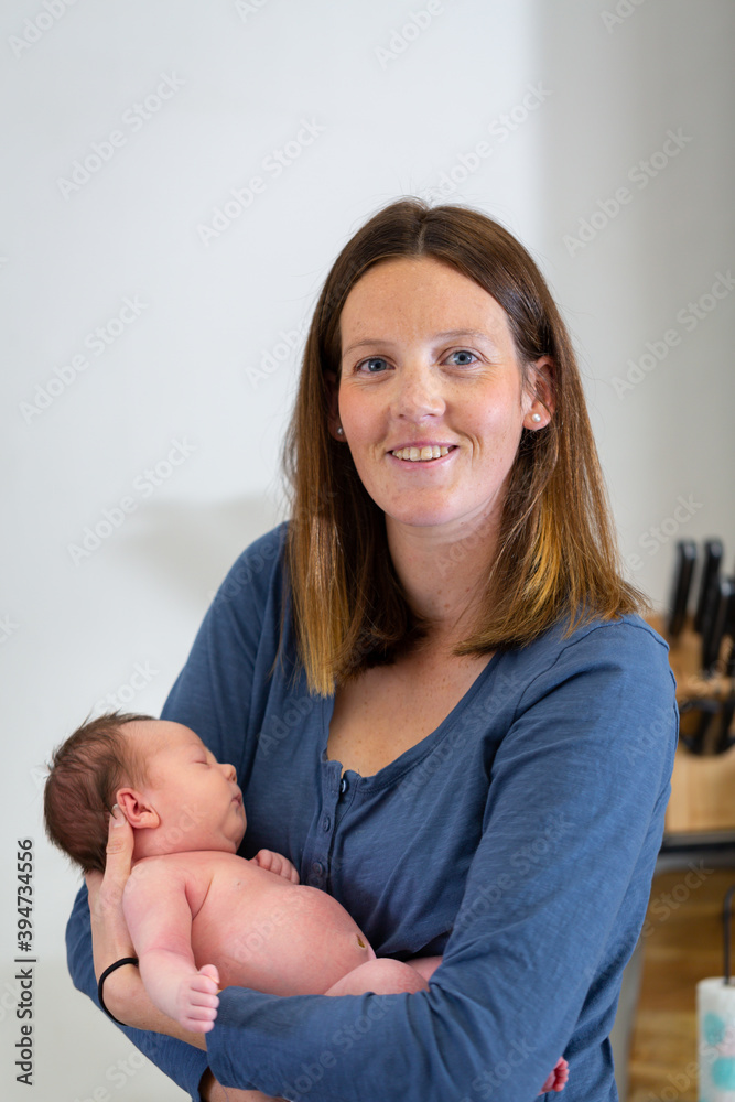 Young mother cradling baby Young mother cradling baby