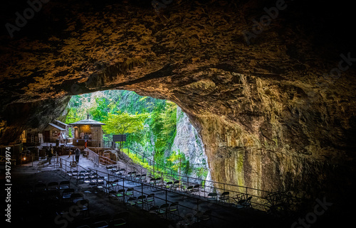 View of the Peak Cavern, also known as the Devil's Arse, in Castleton, Derbyshire, England photo