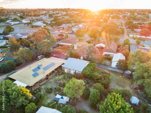 House and garden at sunset in small town