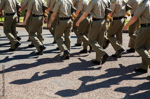 Shadows and legs of marching soldiers in the Australian Defense Force
