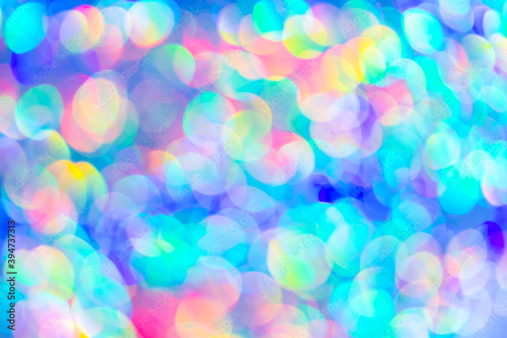 Blurred colorful festive background, blue round lens flare