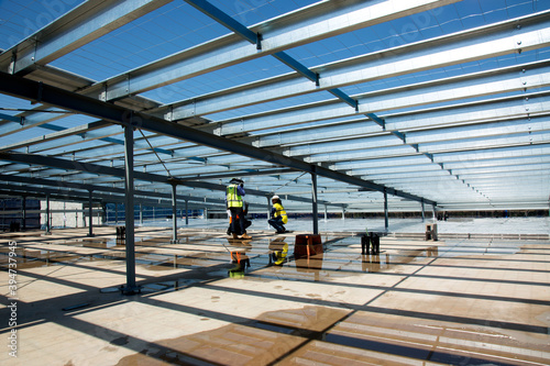 Metal framework and workers on an industrial building site