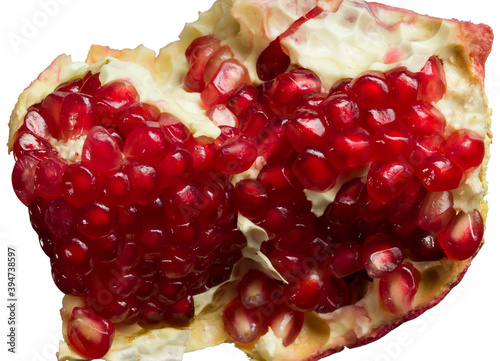 juicy piece of pomegranate close-up, isolated on white background photo