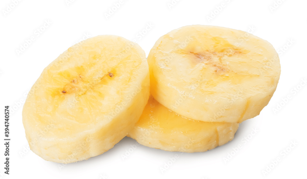 Slices of tasty banana on light background