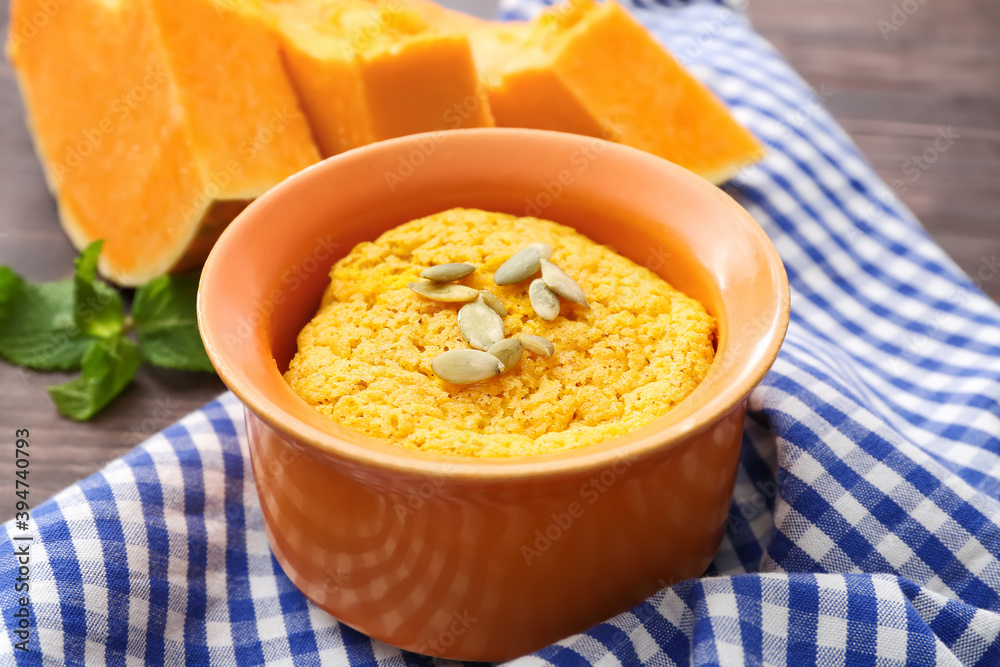 Tasty pumpkin pudding on table