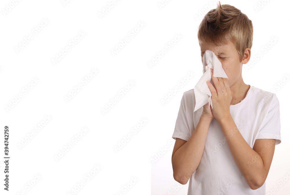 Child sneezing, Schcool boy Blowing Nose With Handkerchief isolated on white background Child sneezing, Schcool boy Blowing Nose With Handkerchief isolated on white background