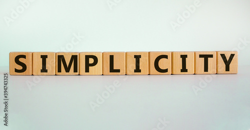 Simplicity concept. Wooden cubes with word 'simplicity'. Beautiful white background. Business and simplicity concept, copy space.