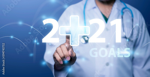 Medical Technology on 2021 target set goals achievement new year resolution, doctor health care worker planning saving world pandemic COVID-19 strategy ideas, graphic icon copy space blue background