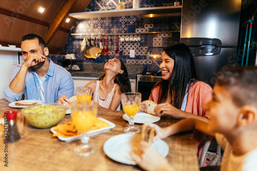 Latin family having dinner at home