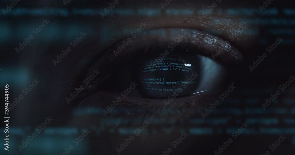 Cinematic macro of young programer's blu eye with latest innovative sophisticated technology display application with augmented reality holograms for realization of new codeproject.