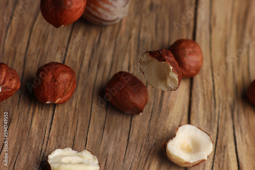 inshell hazelnuts close - up on a wooden board background photo