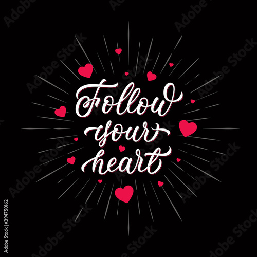 Follow your heart - inscription with pink hearts on black isolated background. Hand lettering design. Vector.